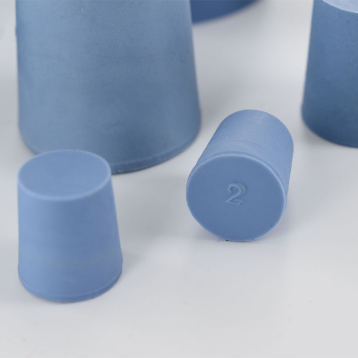 Elastomer cone-shaped caps